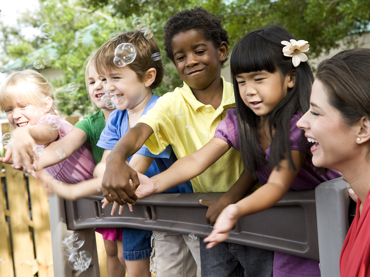 A group of diverse children playing outside