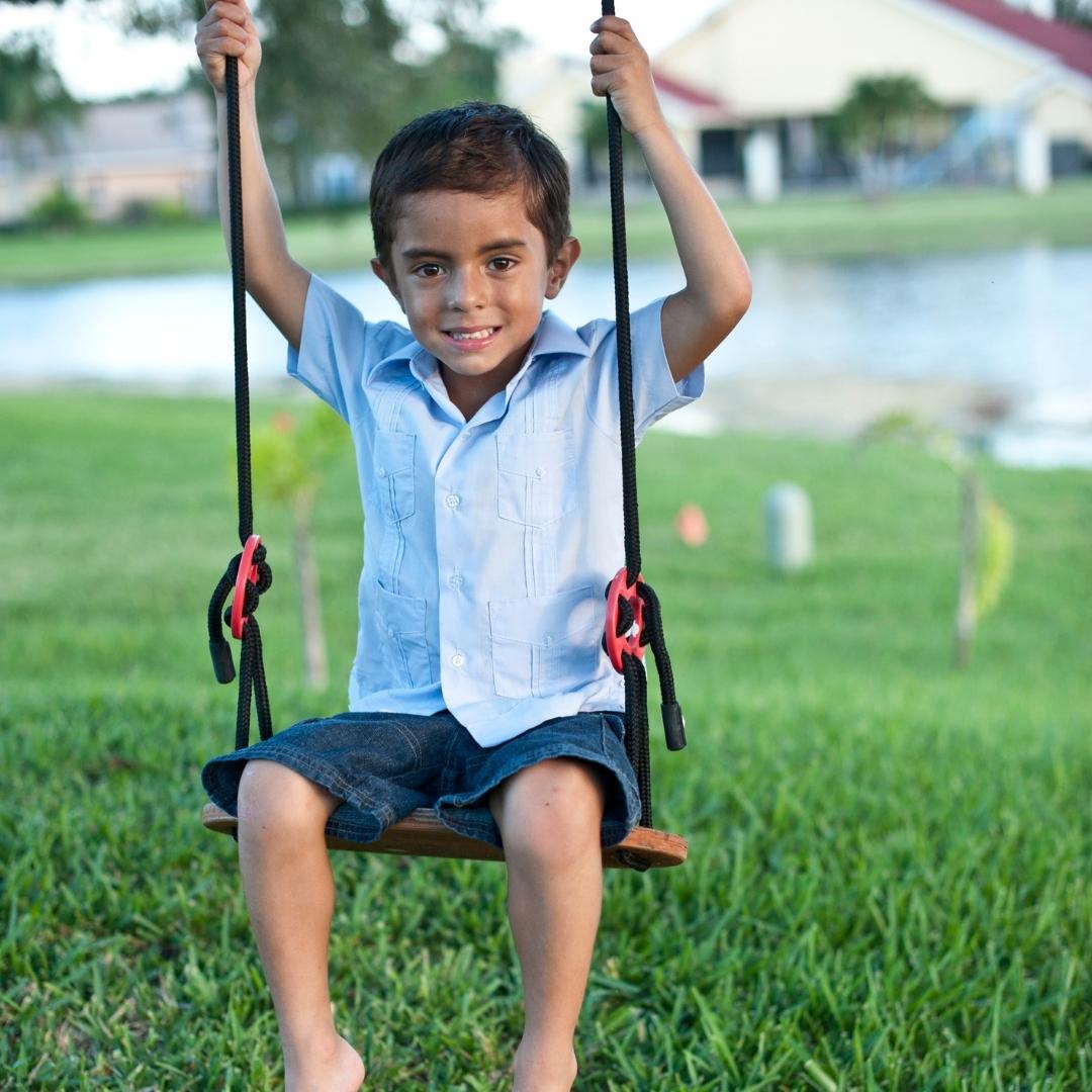 Boy on swing outside